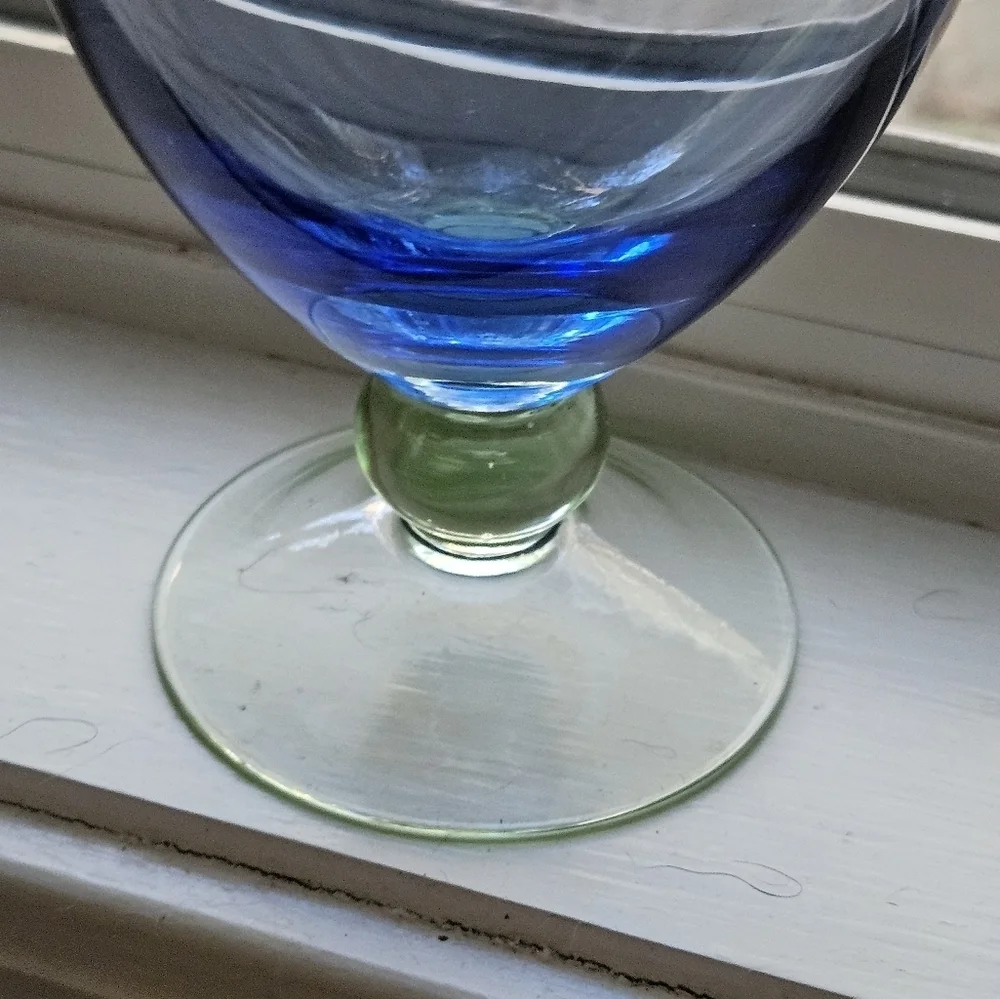 Elegant blue and green glass footed vase.